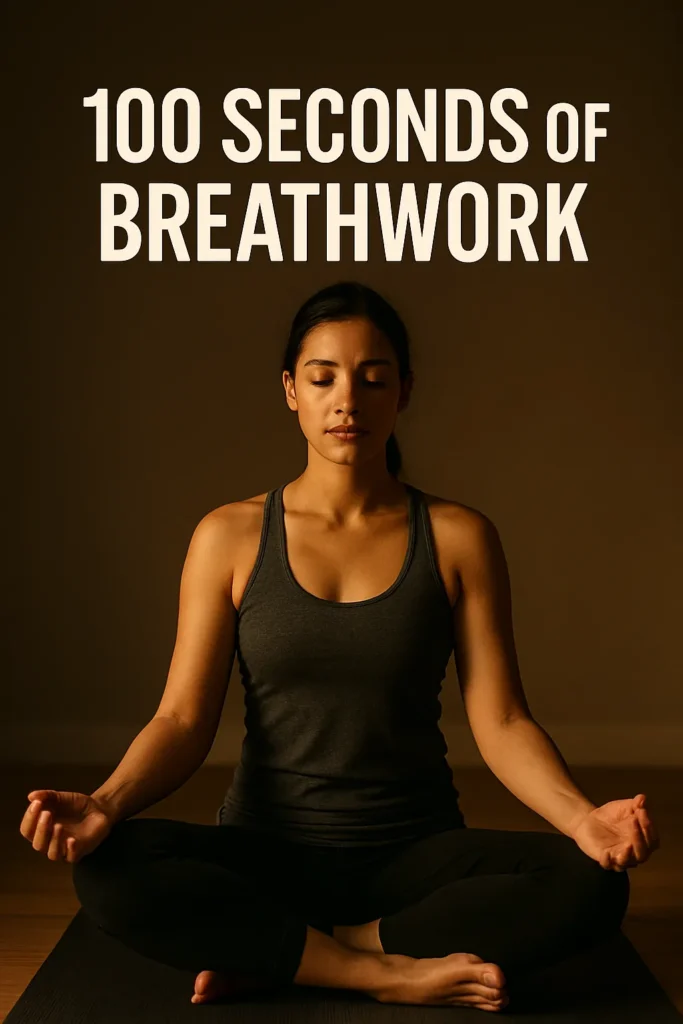 Person sitting cross-legged in low light, calm expression, overlay text- 100 Seconds of Breathwork