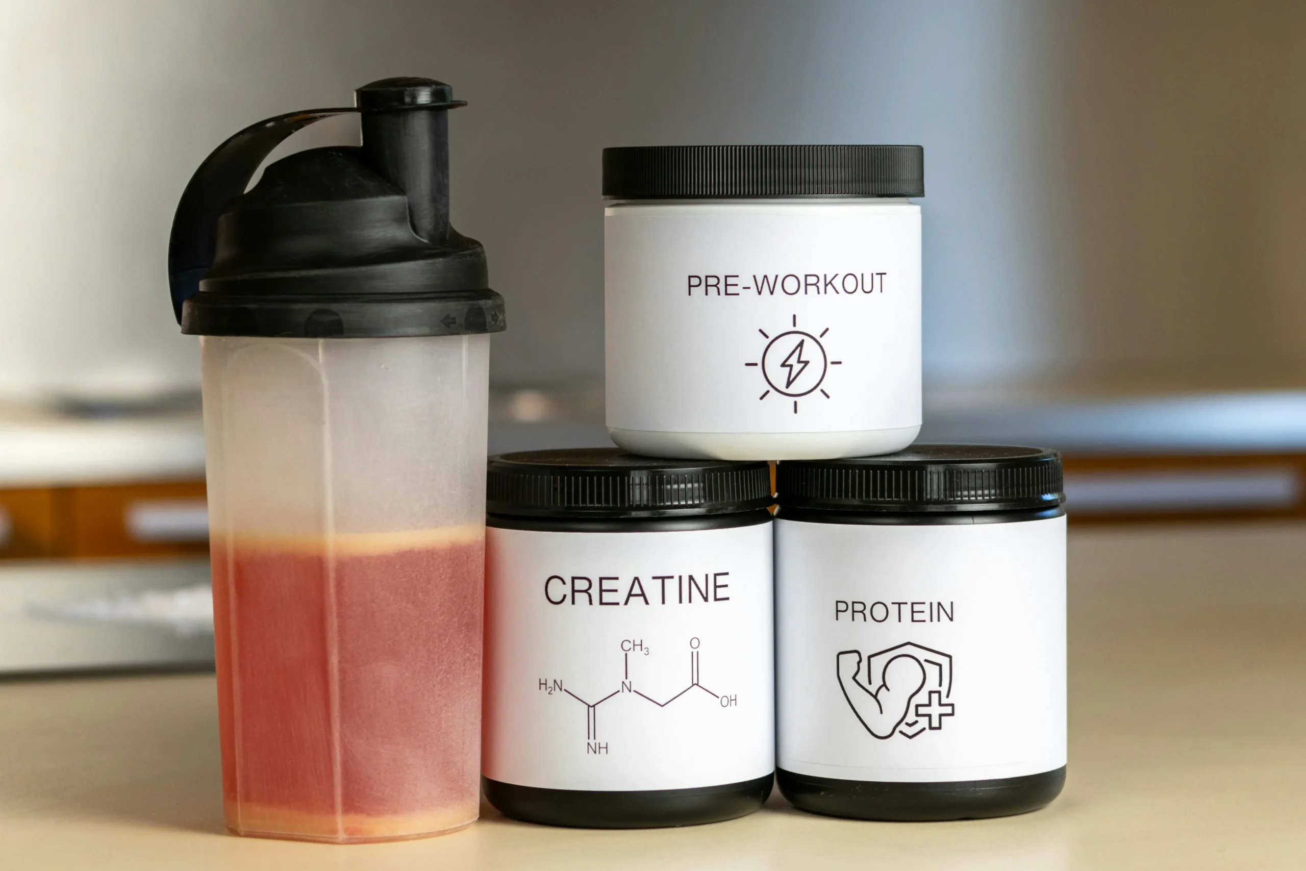 fitness supplyments and shaker in kitchen
